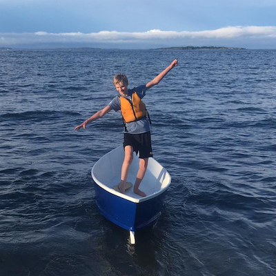 Neil Gabrielson in the sailboat he built